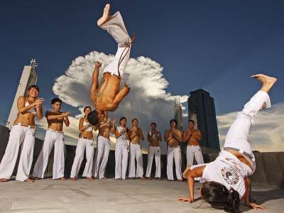 Capoeira mixes martial art, sport and music. Afro-brazilian