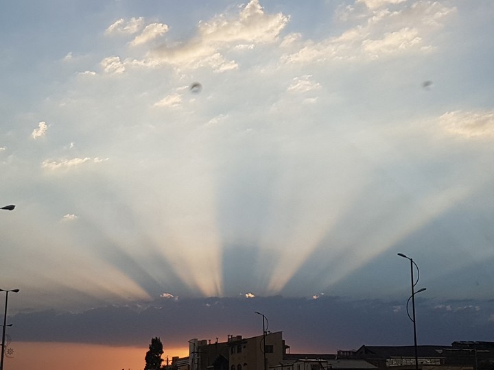 sun set through clouds
