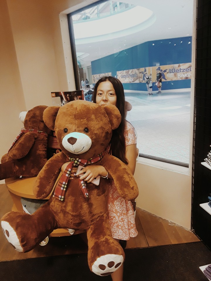 such a cutie holding that bear