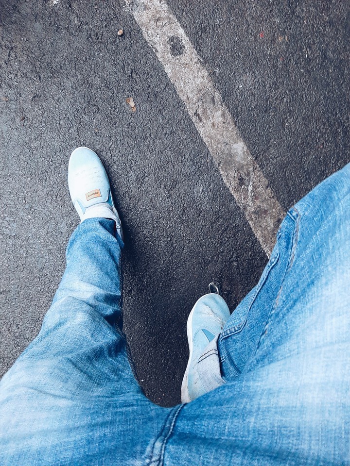 shot on wet roads with jeans and shoes
