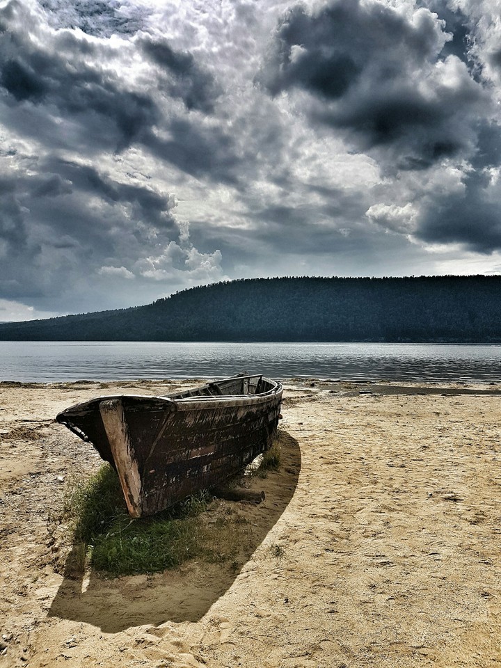 Boat on the coast of the Baikal lake