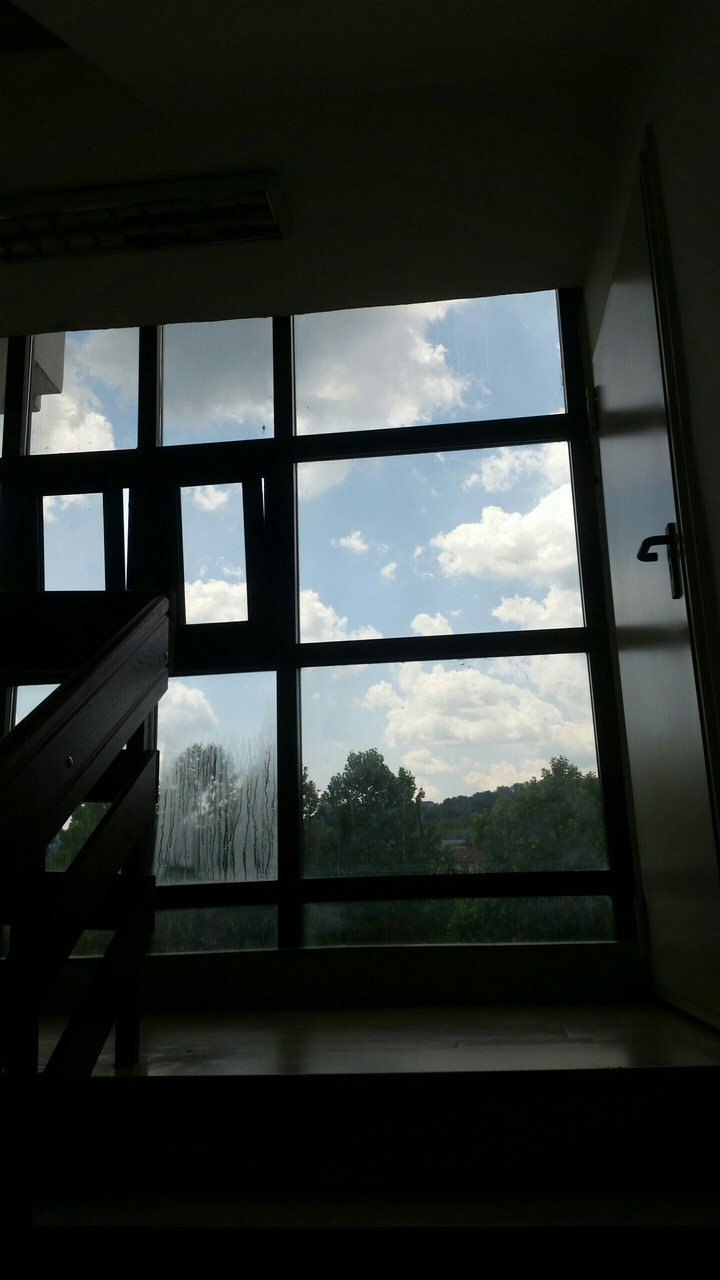 Sky through wet window.
