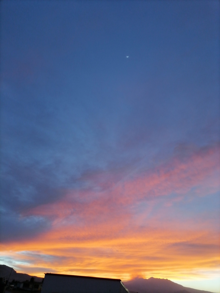 The moon, the sunset, the volcano.