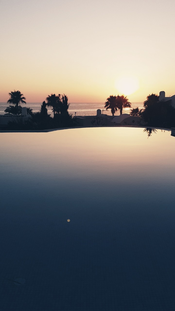 infinity pool looking over sunset