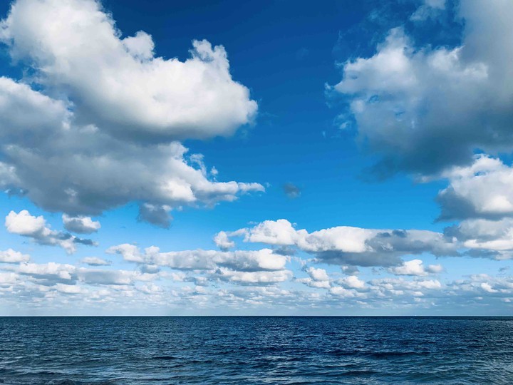 blue sky, deep blue sea and pure white cloud
