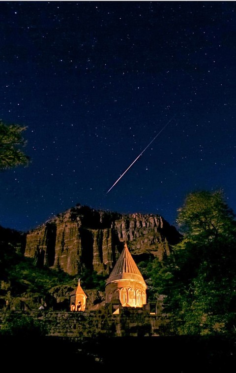Geghard in Armenia, a star Polaris and a bright meteor