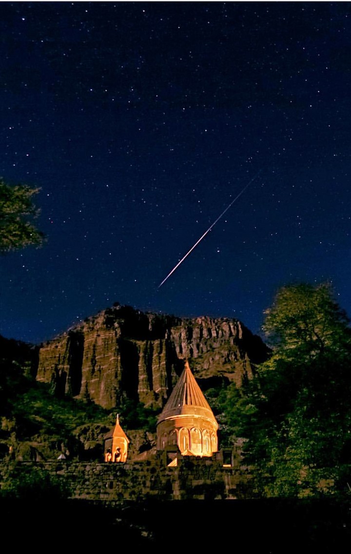 Geghard in Armenia, a star Polaris and a bright meteor