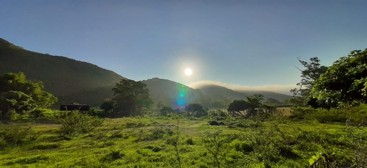Sun behind mountains