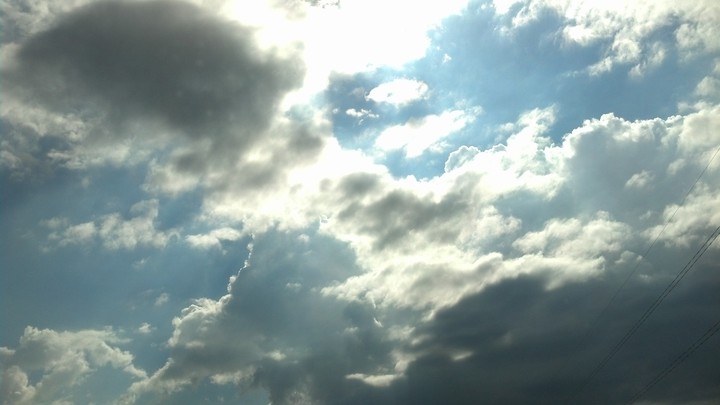 sun behind the clouds