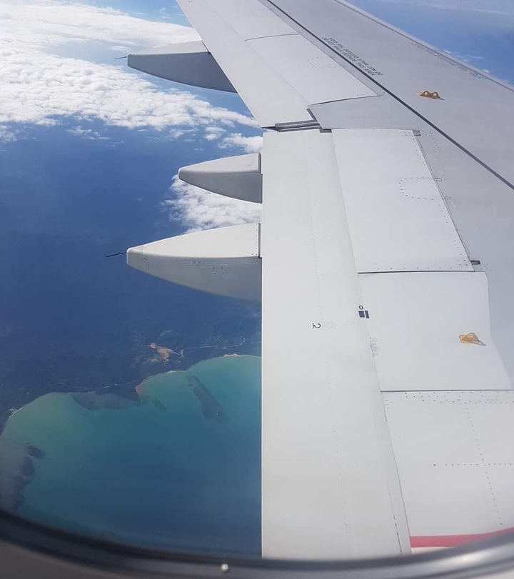 Airplane above islands