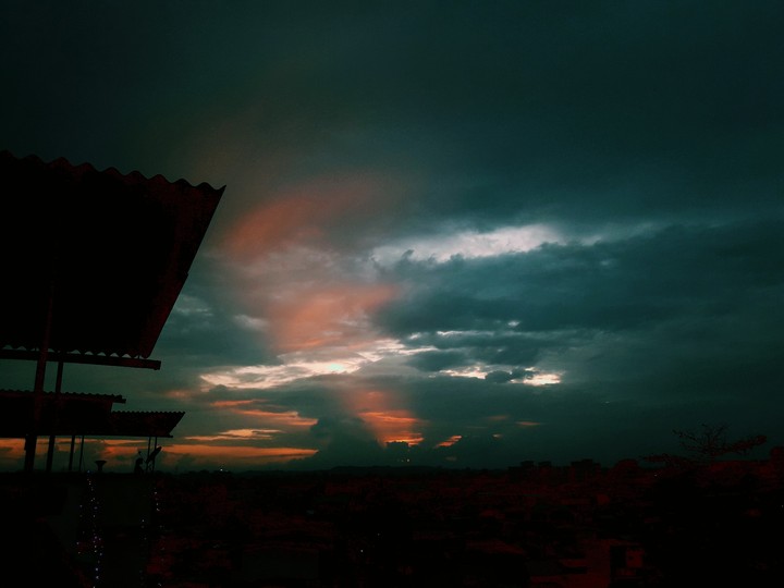The sun rays coming out of clouds ...