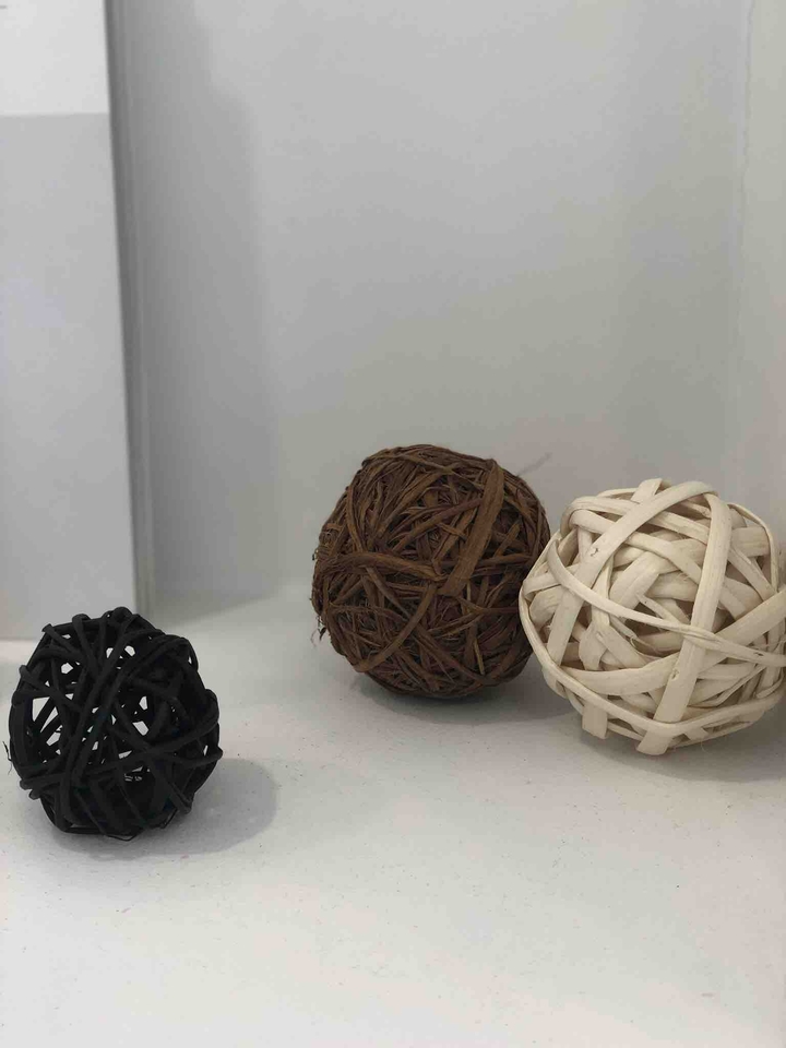 three wooden ball