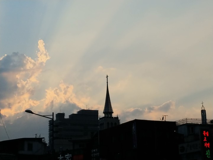 church cross and sunshine