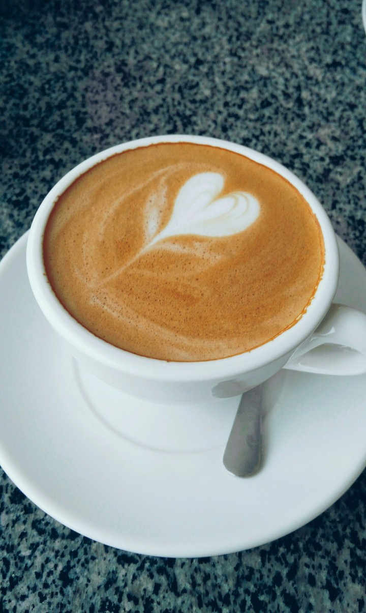 cup of cappuccino with a patterned heart