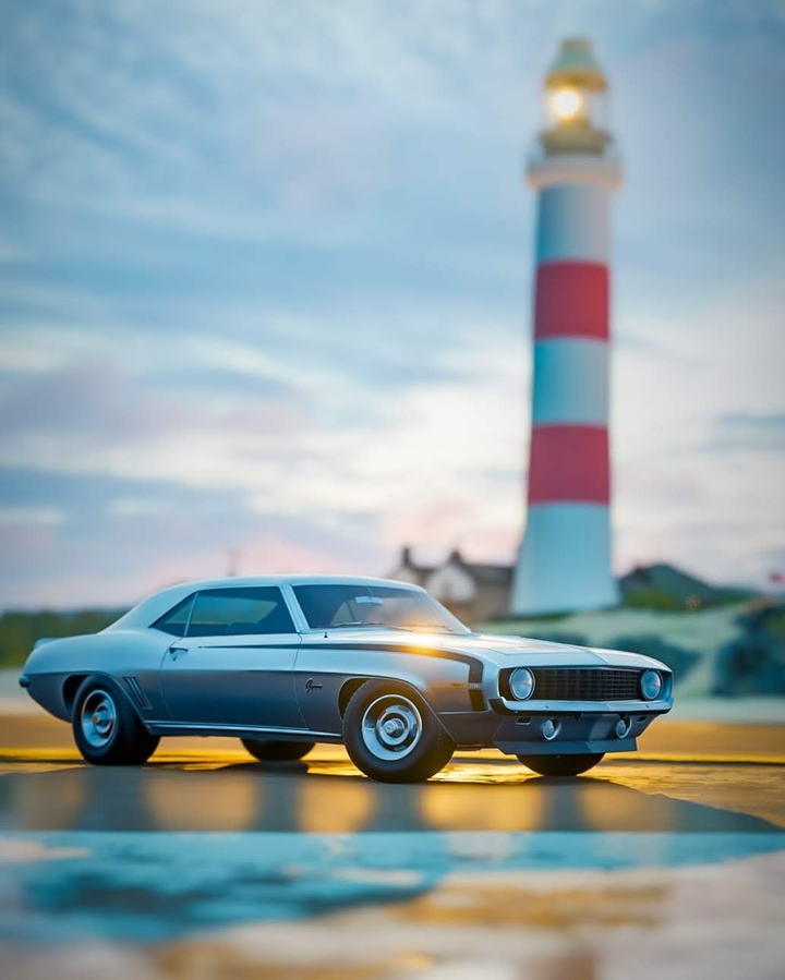 Chevy Camaro by a lighthouse