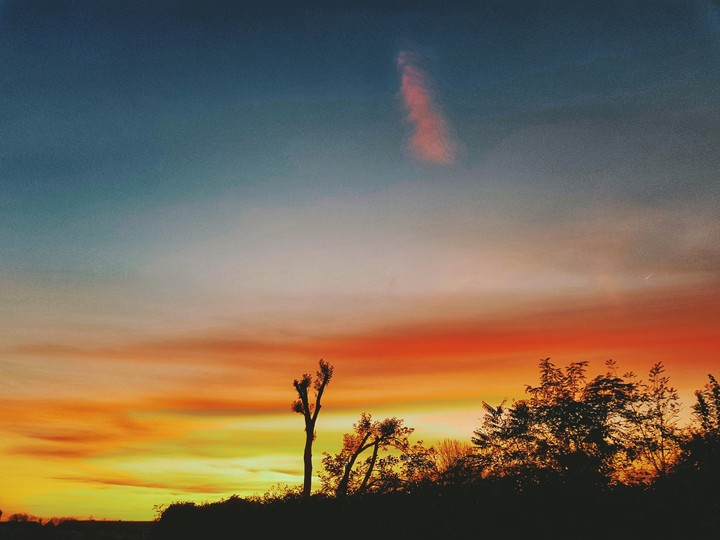 In flames.