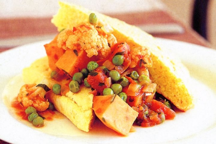 Spicy vegetable with cornbread.