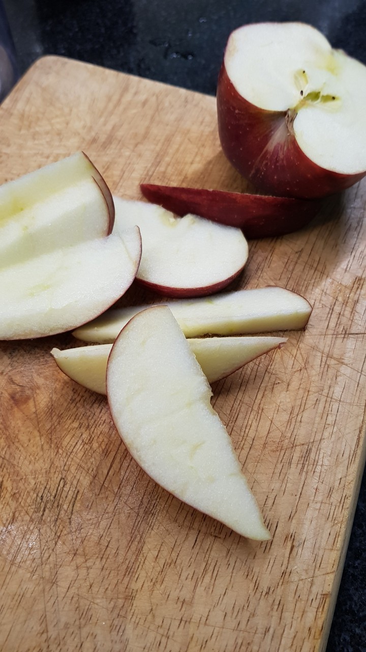Apple on cutting table
