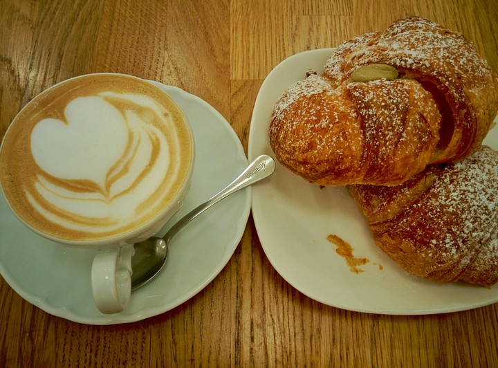 perfect breakfast. cappuccino and brioche.