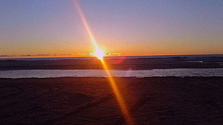 Driving by the beach at sunset