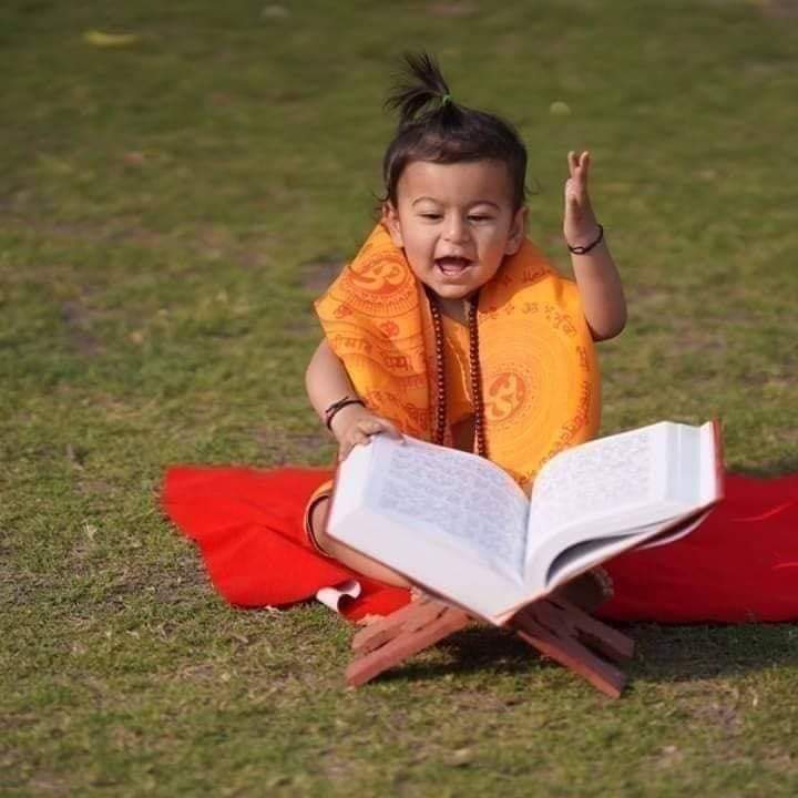 Cute child reading Ramayana