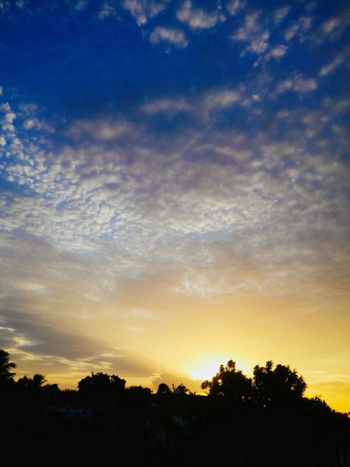 scattered rays and clouds