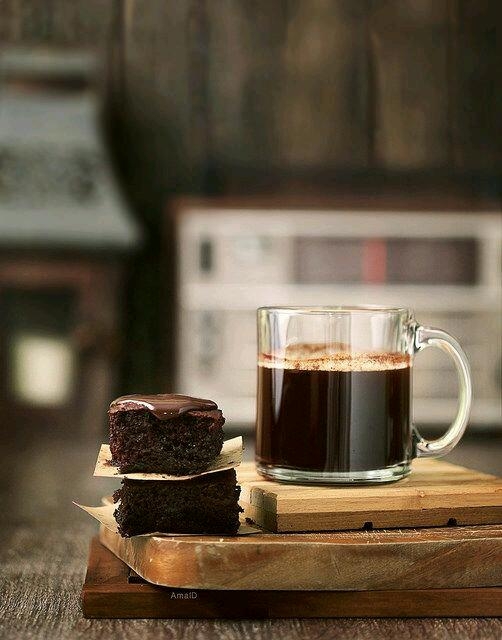 Coffee with indulgent chocolate brownies, melted sauce on