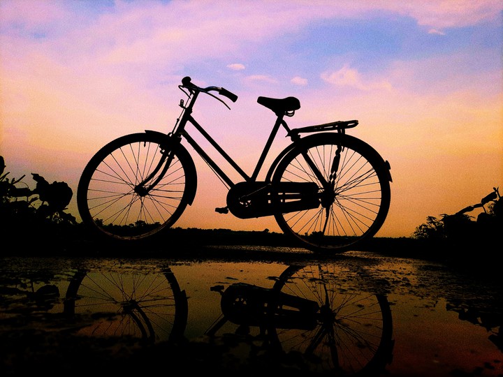 ALONE CYCLE IN SUNSET..