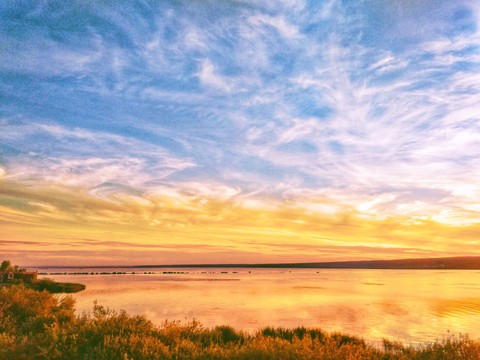 sunset by water