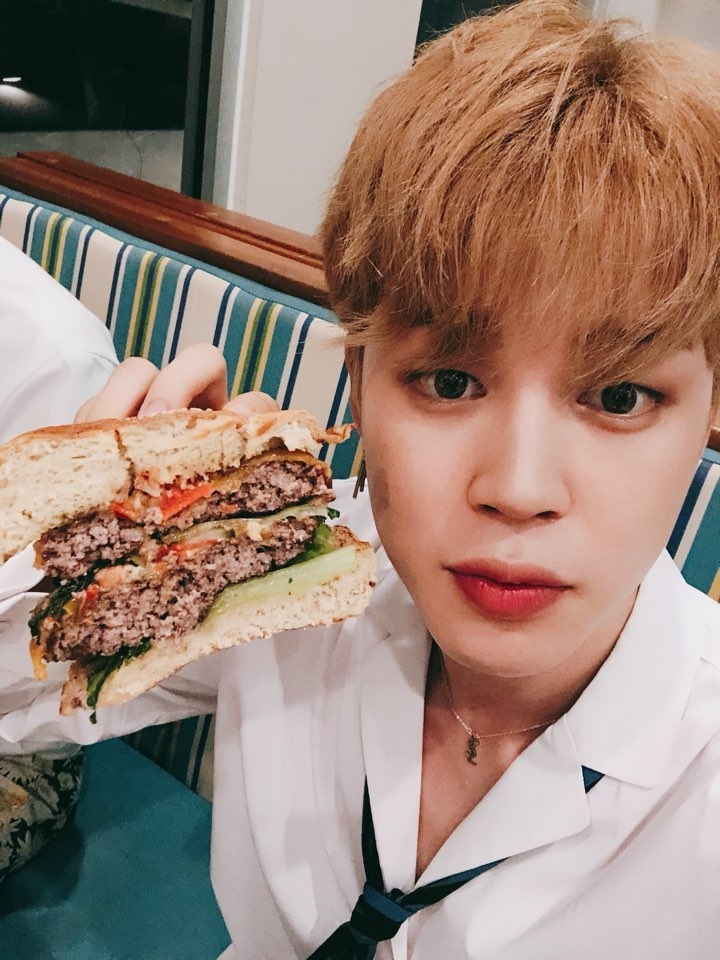 jiminie with a burger