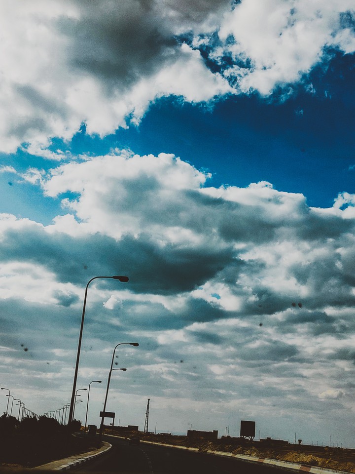 road sky clouds