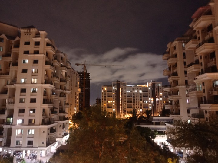 Blissful night view of city lights and clouds