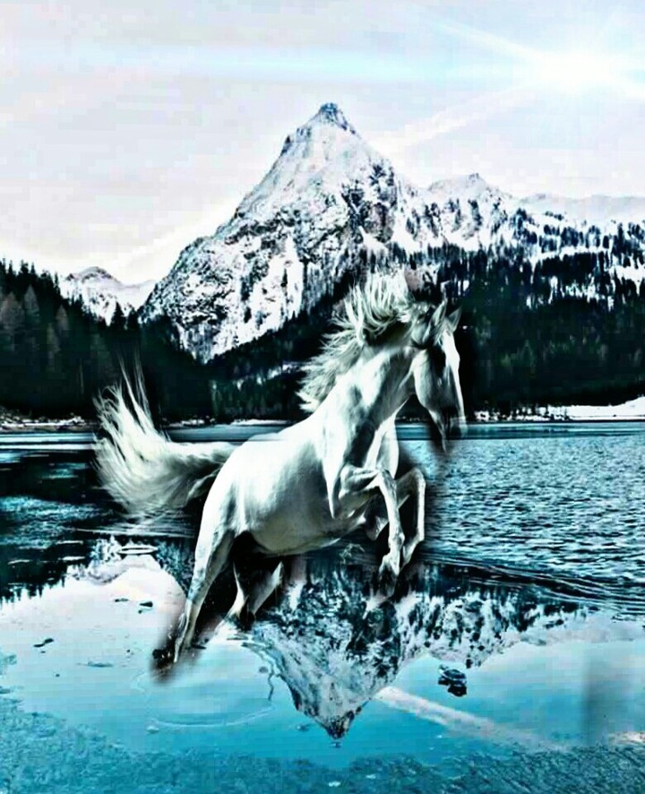 A hours come a lake front an icy mountain