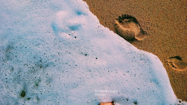 Footprints on the sand.
