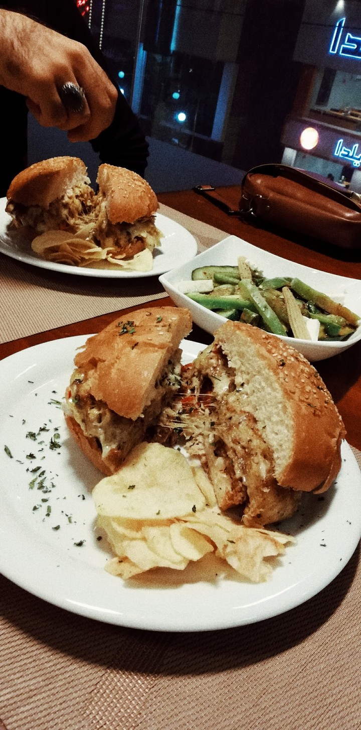 A delicious burger in a restaurant before the corona spread
