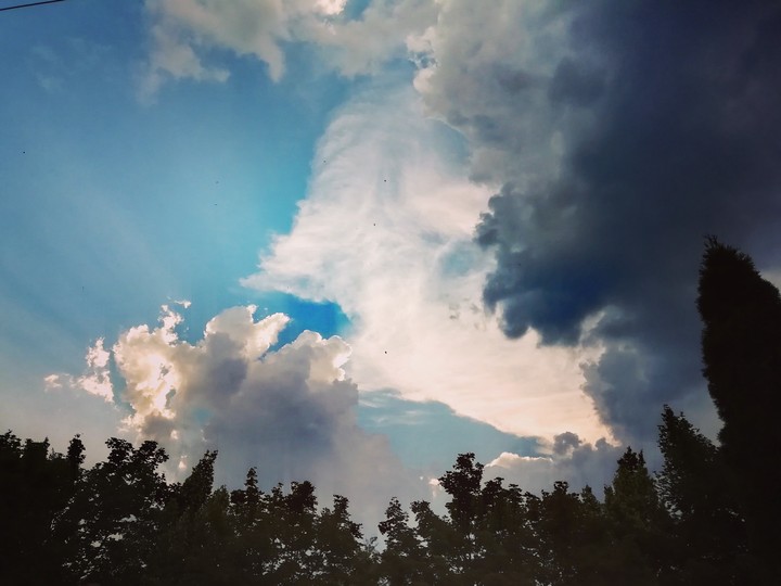 Behind the clouds
