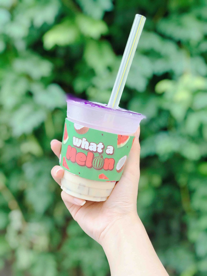 happy from the small cup of milk tea