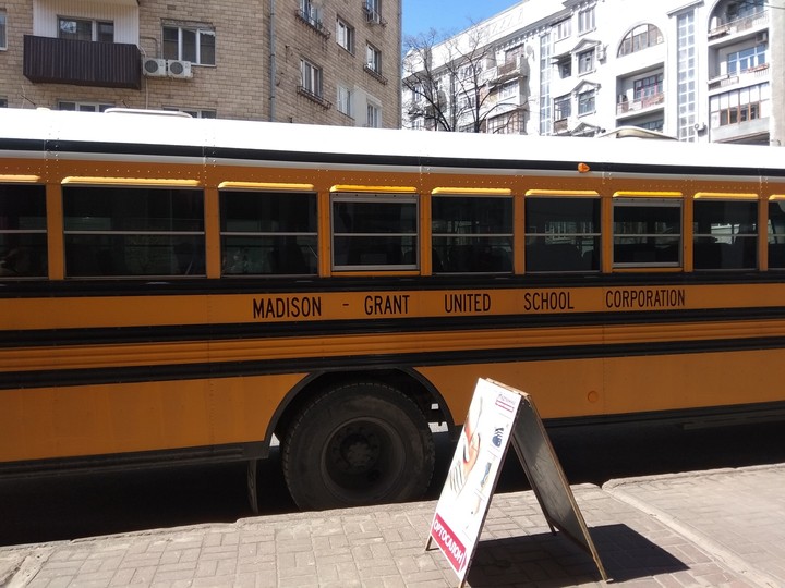 school bus in the centre is the city