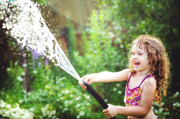 Cute girl playing with water