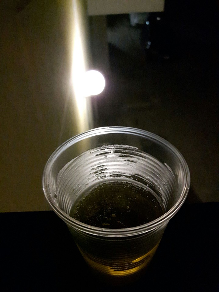 a glass of beer in the night