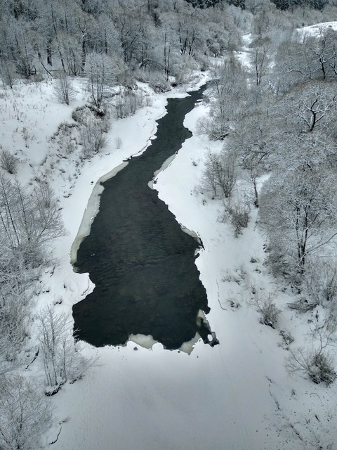 River under the grey sky.