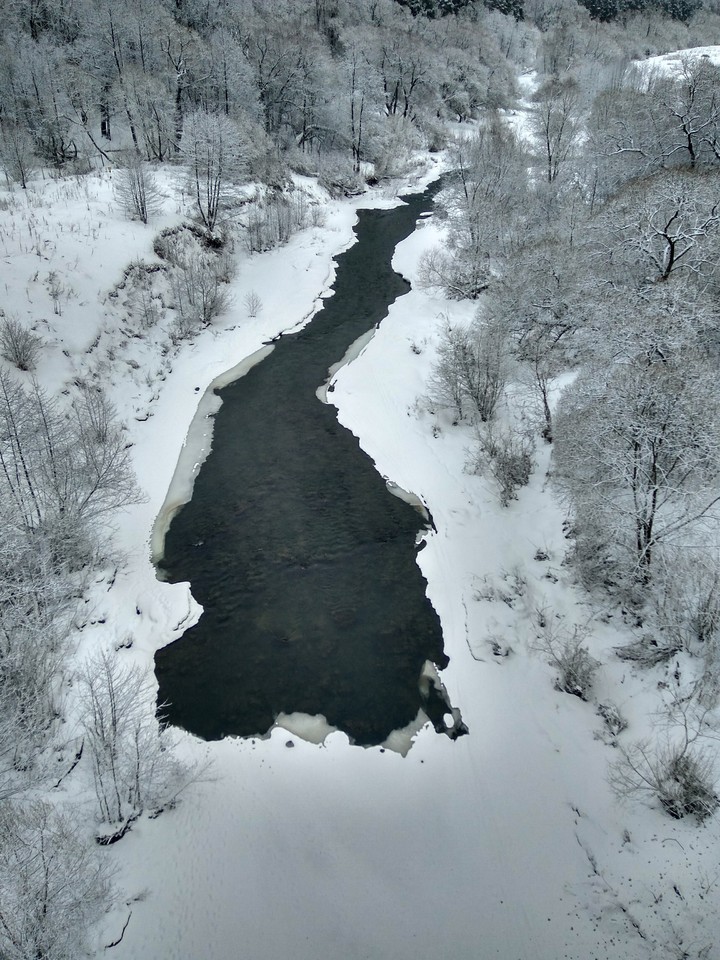 River under the grey sky.