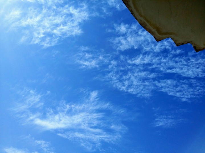 Blue sky and shattered clouds