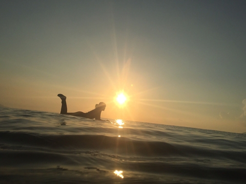 sunrise and surfer