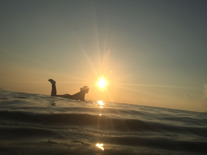 sunrise and surfer