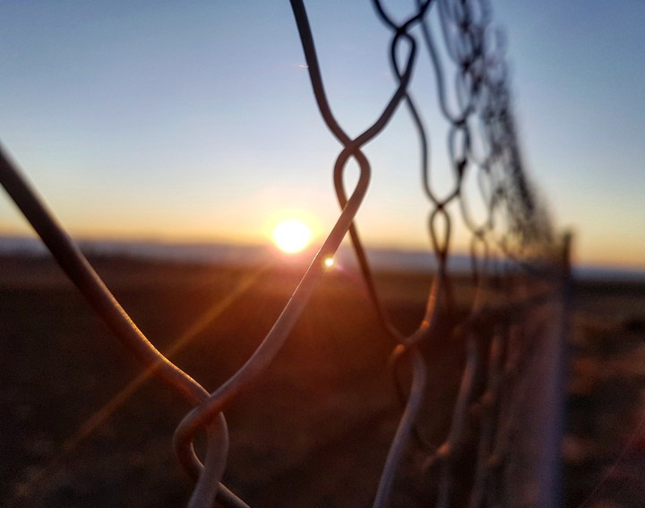 sunset behind a fence!