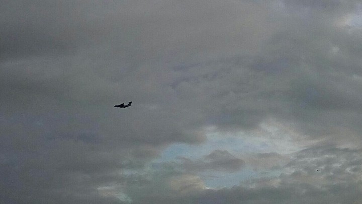 aeroplane against the clouds