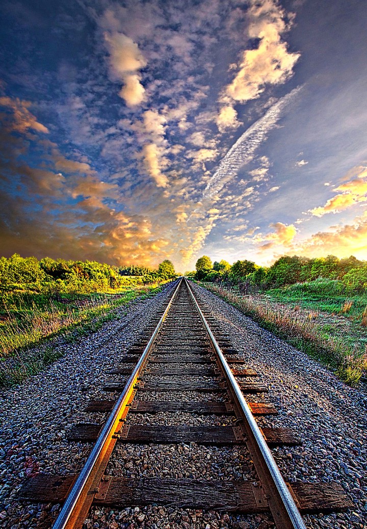 I'm walking on the railway line to hear how far the train is