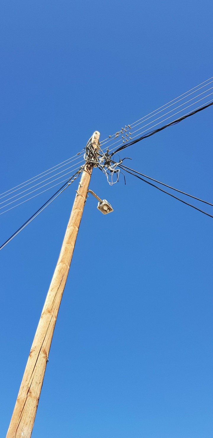 Pole and blue skies