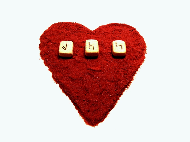 Red heart and runes. Formula of love.
